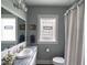 Bathroom featuring shower and vanity with a stone counter, offering a private and functional space at 3934 N Kenwood Ave, Indianapolis, IN 46208