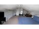 Spacious bedroom featuring neutral walls, carpet flooring, and storage options for a versatile space at 3934 N Kenwood Ave, Indianapolis, IN 46208