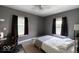This bedroom includes a ceiling fan and is equipped with a desk at 3934 N Kenwood Ave, Indianapolis, IN 46208