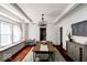 Elegant dining room featuring a modern chandelier and plenty of natural light at 3934 N Kenwood Ave, Indianapolis, IN 46208