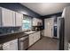 This kitchen features modern appliances, stylish cabinetry, and a sleek countertop for a delightful cooking experience at 3934 N Kenwood Ave, Indianapolis, IN 46208