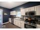 Stylish kitchen features sleek appliances, ample cabinet space, and a functional layout for culinary convenience at 3934 N Kenwood Ave, Indianapolis, IN 46208