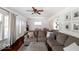 Open-concept living room featuring a plush sectional sofa and access to the dining area at 3934 N Kenwood Ave, Indianapolis, IN 46208