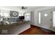 Bright living room with a modern sofa, decorative fireplace, and natural light from the entry at 3934 N Kenwood Ave, Indianapolis, IN 46208