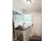 Cozy mudroom with cabinet storage, natural light, and easy access to the outdoors, blending functionality with style at 3934 N Kenwood Ave, Indianapolis, IN 46208