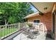 Relaxing balcony with outdoor furniture and lush greenery at 415 Woodhill Dr, Indianapolis, IN 46227