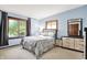 Light and airy bedroom with beautiful natural light from the large window creates an inviting atmosphere at 415 Woodhill Dr, Indianapolis, IN 46227