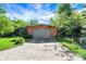 Well-kept driveway and a brick garage at 415 Woodhill Dr, Indianapolis, IN 46227