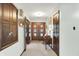 Bright and airy foyer featuring hardwood floors and elegant wood accents at 415 Woodhill Dr, Indianapolis, IN 46227