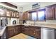 Functional kitchen featuring a large window and stainless steel appliances at 415 Woodhill Dr, Indianapolis, IN 46227