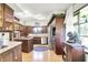 Charming kitchen area featuring lots of wood cabinets, stainless appliances, and lots of light at 415 Woodhill Dr, Indianapolis, IN 46227