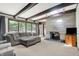 Spacious living area with stone fireplace and large windows offering scenic views at 415 Woodhill Dr, Indianapolis, IN 46227