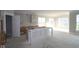 Unfinished spacious kitchen area featuring large windows and an island with white accents at 4290 Ironclad Dr, Bargersville, IN 46106