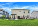 Expansive backyard with a patio, outdoor seating, and lush green lawn, perfect for outdoor activities at 4602 Hayward Way, Westfield, IN 46062