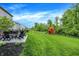 Large backyard featuring a patio with outdoor furniture, a playset, and ample green space at 4602 Hayward Way, Westfield, IN 46062