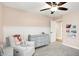 Bedroom featuring a changing table, a comfortable armchair, board and batten accent wall, and playful decor at 4602 Hayward Way, Westfield, IN 46062