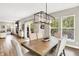 Dining room featuring a modern chandelier, large windows and a seamless flow to the patio at 4602 Hayward Way, Westfield, IN 46062