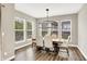 Dining room with large windows offering views and featuring modern lighting fixtures at 4602 Hayward Way, Westfield, IN 46062
