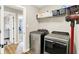 Well-organized laundry room featuring modern machines, shelving, and easy access to other rooms at 4602 Hayward Way, Westfield, IN 46062