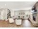 Spacious living room with a stone fireplace, large windows, and comfortable seating at 4602 Hayward Way, Westfield, IN 46062
