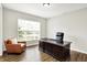 Comfortable office with large desk, leather chair, and a window with natural light at 4602 Hayward Way, Westfield, IN 46062