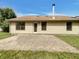 Backyard patio of home with beige siding and a door leading to the interior at 4825 May Ridge Ln, Indianapolis, IN 46254