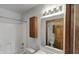 Bathroom with bath tub, toilet and cabinet with mirror, ideal for relaxing at 4825 May Ridge Ln, Indianapolis, IN 46254