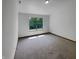Cozy bedroom with soft carpet, a bright window, and ample natural light at 4825 May Ridge Ln, Indianapolis, IN 46254