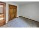 Bedroom features carpet, a closet with wood sliding doors and hardwood floors in the entrance at 4825 May Ridge Ln, Indianapolis, IN 46254