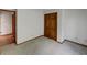 Bedroom features carpet, a window, and a closet with wood sliding doors at 4825 May Ridge Ln, Indianapolis, IN 46254