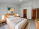 Beautifully staged main bedroom with a large bed, stylish decor, and ensuite bathroom at 4825 May Ridge Ln, Indianapolis, IN 46254