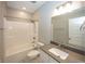 Bright bathroom features a shower-tub combo with chrome fixtures and a vanity with modern countertop at 5196 Canberra Ct, McCordsville, IN 46055