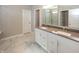 Bathroom featuring double sink vanity, a large mirror, and tile flooring at 5196 Canberra Ct, McCordsville, IN 46055