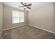 Bedroom featuring plush carpet, a modern ceiling fan fixture, and plenty of natural light at 5196 Canberra Ct, McCordsville, IN 46055