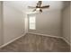 Bedroom featuring plush carpet, a modern ceiling fan fixture, and a window for natural light at 5196 Canberra Ct, McCordsville, IN 46055