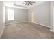 Bedroom featuring plush carpet, a modern ceiling fan, tray ceiling, and plenty of natural light at 5196 Canberra Ct, McCordsville, IN 46055