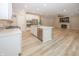 Kitchen and living room combo featuring hardwood floors and stainless steel appliances at 5196 Canberra Ct, McCordsville, IN 46055
