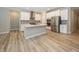 Open kitchen featuring stainless steel appliances and hardwood floors at 5196 Canberra Ct, McCordsville, IN 46055