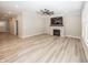 Spacious living room featuring a fireplace, ceiling fan and hardwood floors at 5196 Canberra Ct, McCordsville, IN 46055