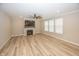 Open living room featuring a fireplace and hardwood floors at 5196 Canberra Ct, McCordsville, IN 46055