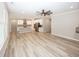 Open living space featuring a modern kitchen island with hardwood floors and a ceiling fan at 5196 Canberra Ct, McCordsville, IN 46055