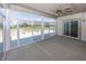The covered patio features concrete flooring, ample light, and a ceiling fan, perfect for outdoor living at 5196 Canberra Ct, McCordsville, IN 46055