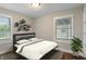 Bright bedroom featuring a comfy bed, neutral tones, and natural light at 5473 E 18Th St, Indianapolis, IN 46218