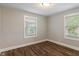 Cozy bedroom with two large windows and sleek hardwood floors at 5473 E 18Th St, Indianapolis, IN 46218