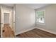 Bedroom features modern wood floors and neutral paint at 5473 E 18Th St, Indianapolis, IN 46218