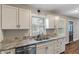 Well-appointed kitchen features granite countertops and stainless steel dishwasher at 5473 E 18Th St, Indianapolis, IN 46218