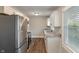 Modern kitchen features stainless steel appliances, white cabinets, and granite countertops at 5473 E 18Th St, Indianapolis, IN 46218