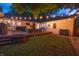 Cozy deck with outdoor seating, string lights, and access to a well-maintained backyard at 5601 Rosslyn Ave, Indianapolis, IN 46220