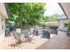 The backyard includes a furnished deck with comfortable seating arrangements perfect for relaxing and entertaining guests at 5601 Rosslyn Ave, Indianapolis, IN 46220