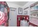 Cozy bathroom with red tile accents, decorative shower curtain, and ample storage space at 5601 Rosslyn Ave, Indianapolis, IN 46220